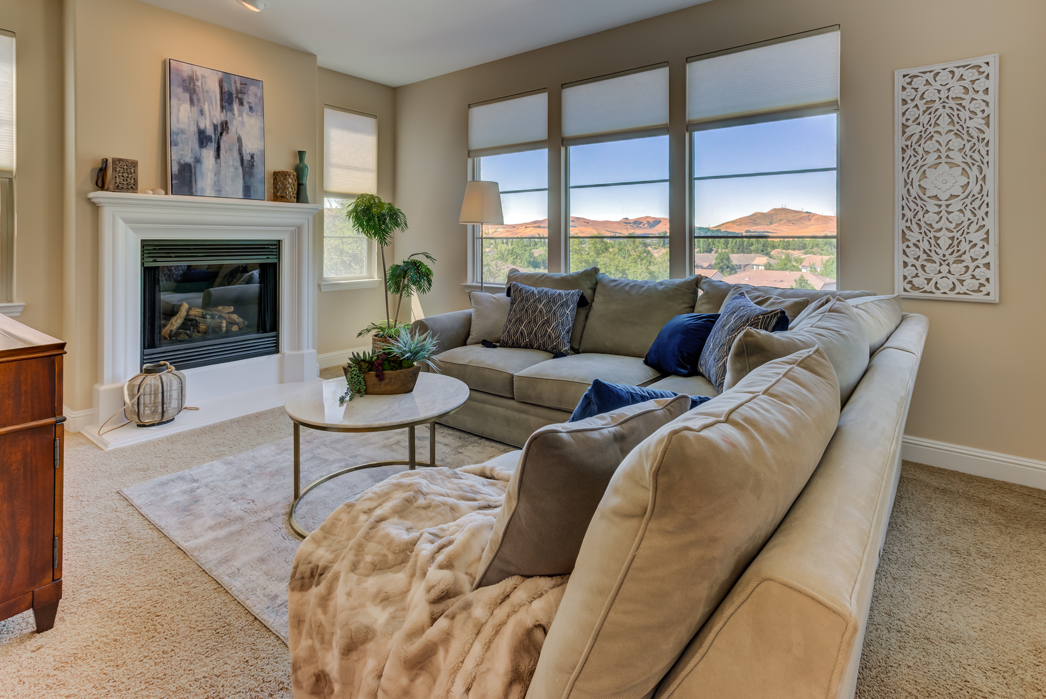 luxury living room staged with sectional and decor