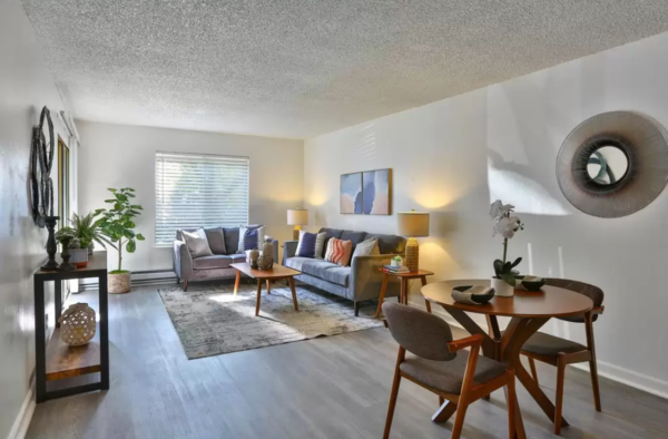 dining room staging with staged living room in the background